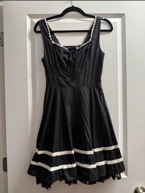 Black a line dress with white trim
